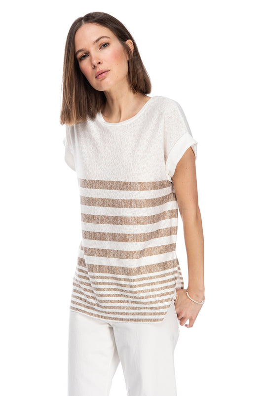 A woman in a casual white CATY STRAP TUNIC TEE by B Collection by Bobeau with horizontal placement stripes standing against a white background.